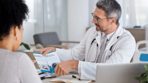 A doctor discussing medical information with a patient, exemplifying a personalized approach to health management.