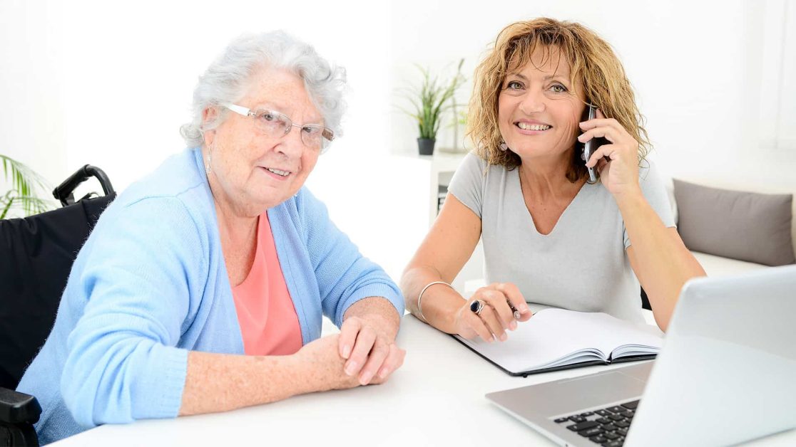 Mom and daughter on the phone with insurance on the comuter with son.