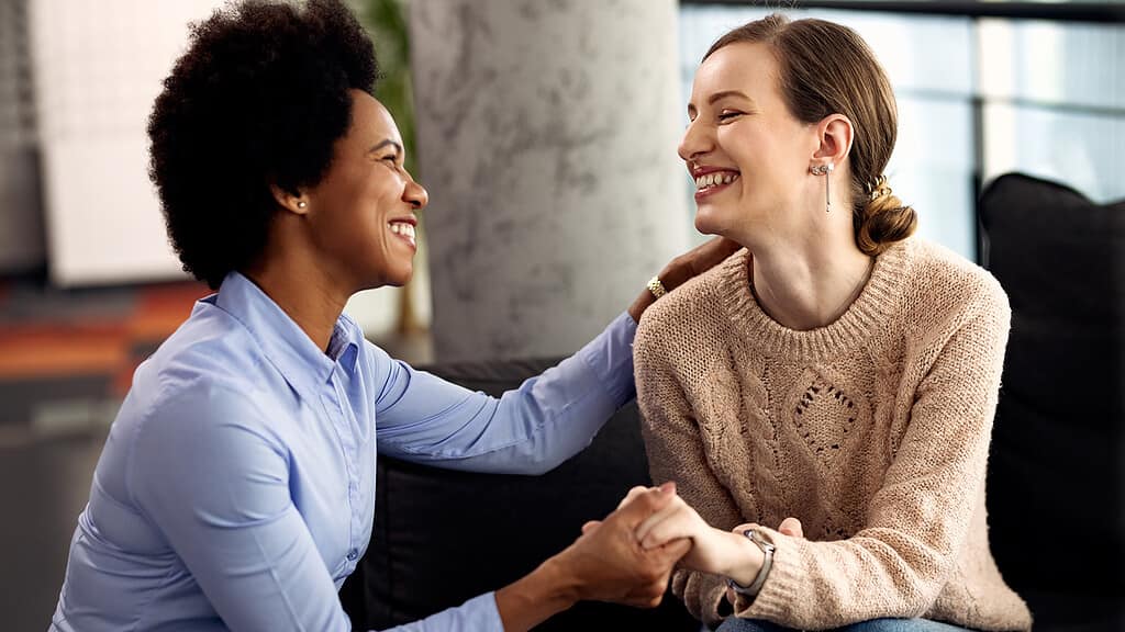 A supportive interaction between two individuals, one possibly a healthcare provider, illustrating the 'Role of patient advocate' in a medical setting.