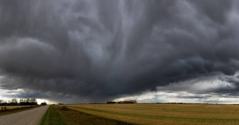 Dark storm clouds forming over open farmland, symbolizing the need for emergency medical preparedness.