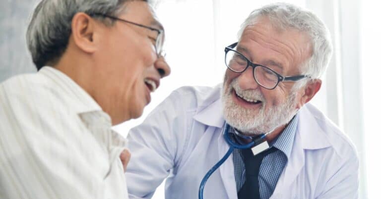A doctor and patient share a positive encounter during a medical visit, showing trust and open communication in healthcare.
