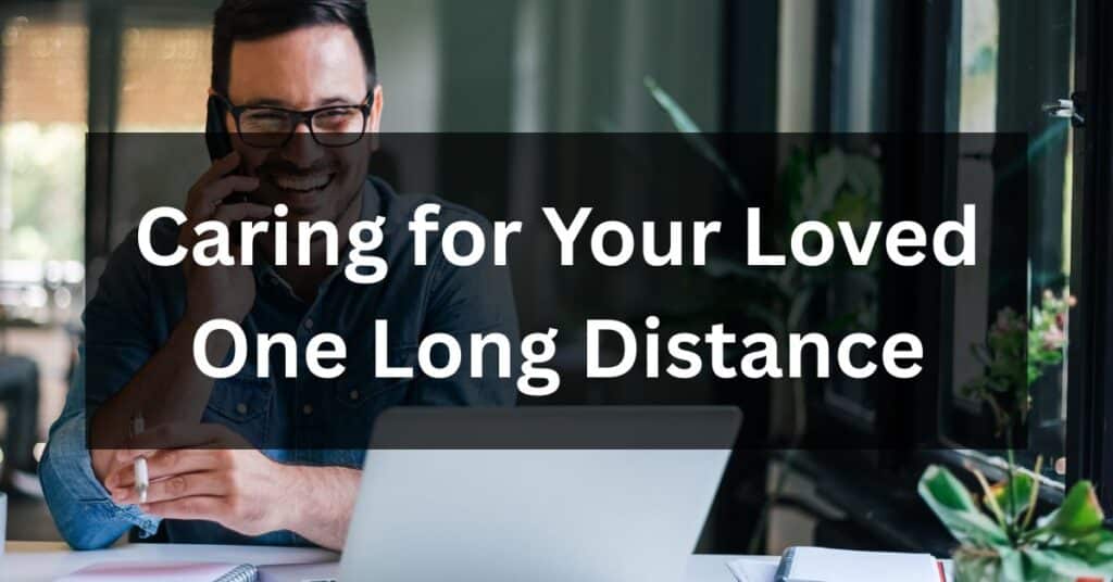 Man talking on the phone while looking at a laptop, illustrating the challenges of caring for your loved one long distance.
