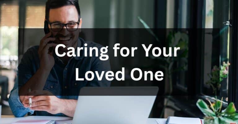 Man talking on the phone while looking at a laptop, illustrating the challenges of caring for your loved one at home or at a distance.