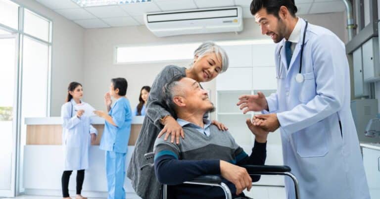 Value-based care explained through patient-centered healthcare, showing a physician and care team engaging with an older patient and caregiver to support coordinated, outcome-focused care.